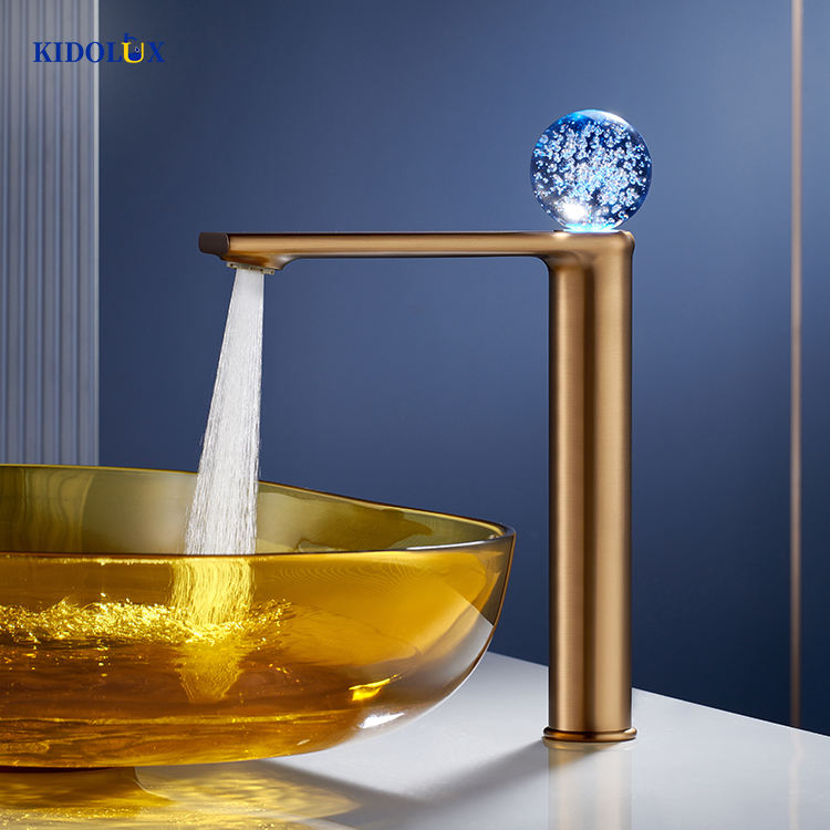 Sleek deck-mounted basin tap featuring a brushed brass finish