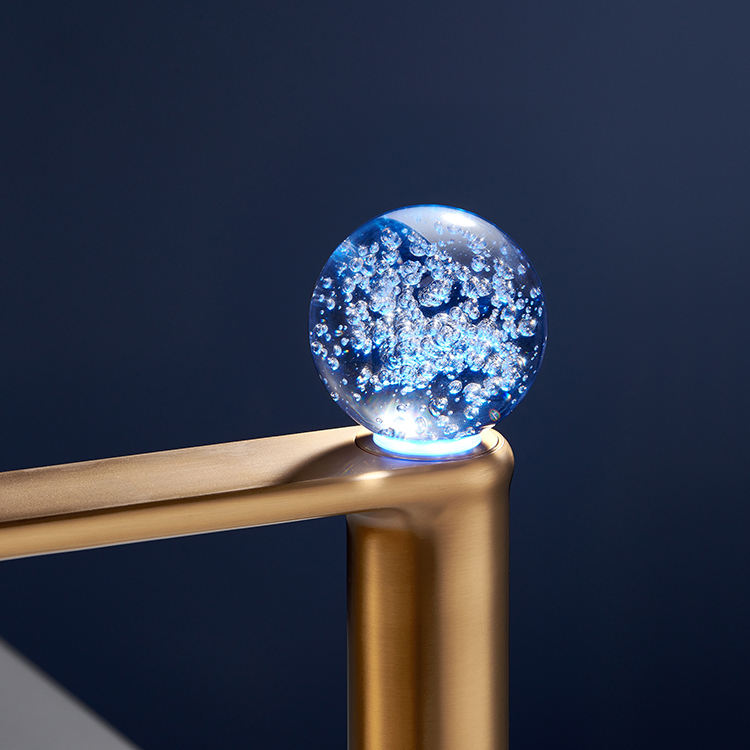 Sleek deck-mounted basin tap featuring a brushed brass finish