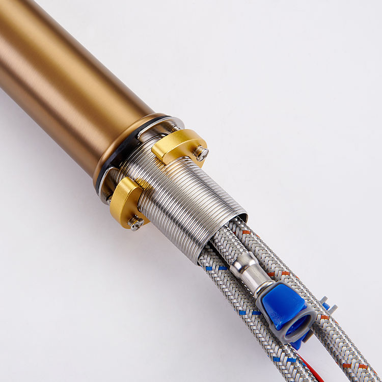 Sleek deck-mounted basin tap featuring a brushed brass finish