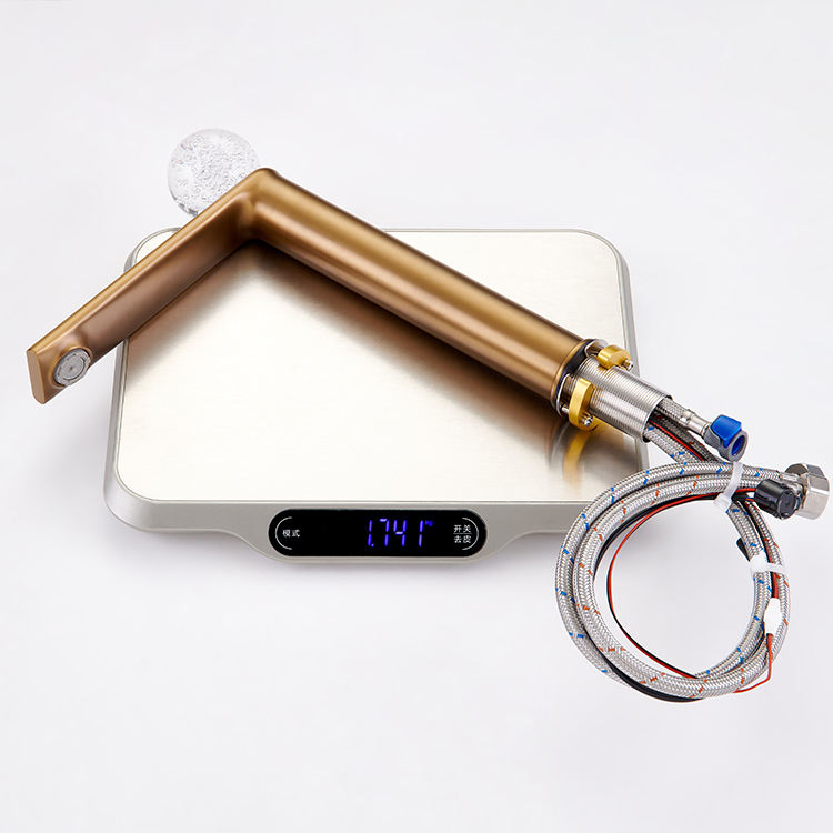 Sleek deck-mounted basin tap featuring a brushed brass finish