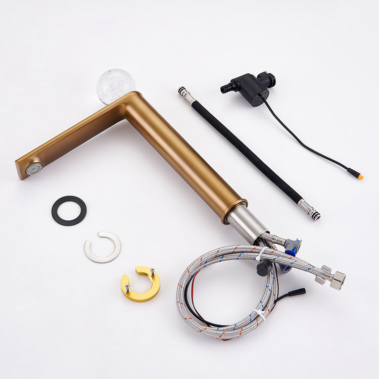 Sleek deck-mounted basin tap featuring a brushed brass finish